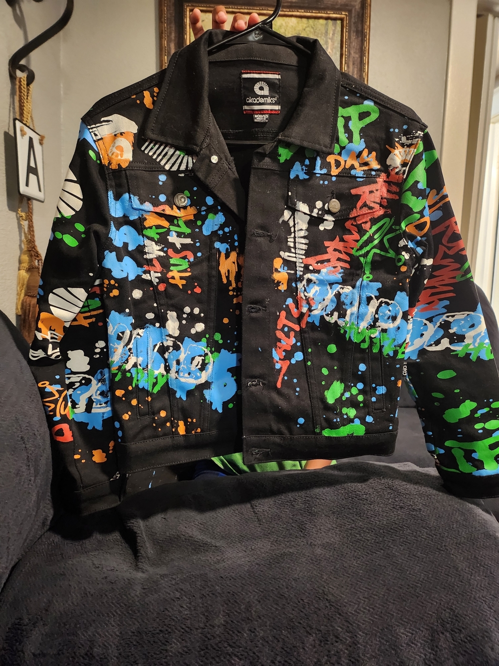 Akademiks Black Denim Jacket with Multicolor Paint-Splash Graphic